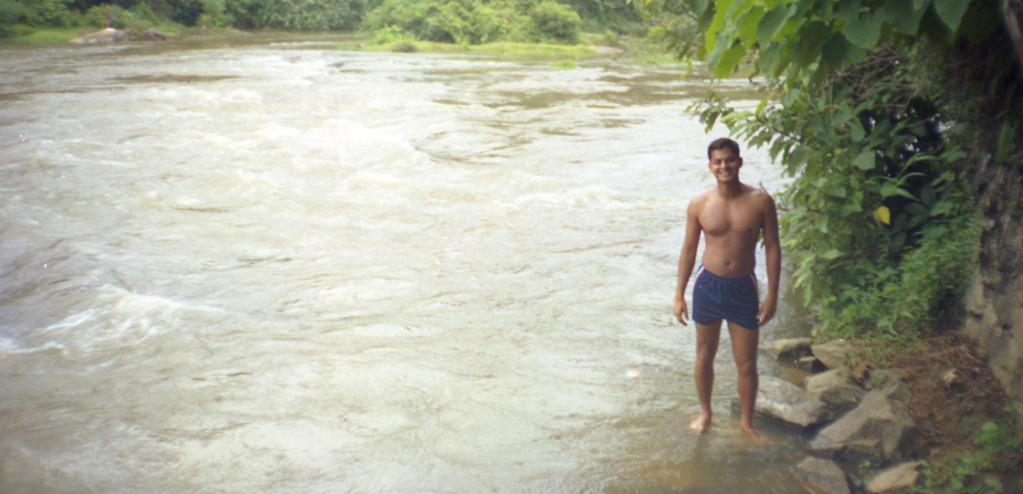 Photo of Shamnad by the river that flows behind his home in Kulathupuzha, Kerala